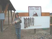 Jimmy Ensign of Miles City, MT, with a 12-pound Laker and the rest of a day's catch.