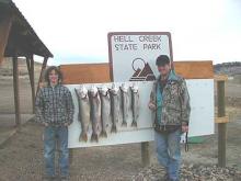Jimmy and John Ensign of Miles City with their limit of 6, 8, 9, 10, 10 & 12 pound Lake Trout .