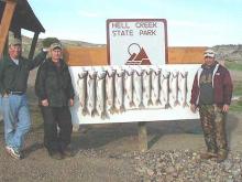Eric Deseth, C. B.  Schantz and Jeff Rodenbaugh, all of Miles City, with a good day's catch of lake trout.