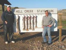 Ross Kellogg, of Ionia, IA, and Daryl Pistorius, of Billings, with 5, 8, 8, 10, and 12 pound lake trout and a 17 pound northern pike.