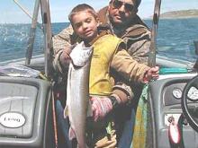 Steve and Grady Gilpatrick, of Hilger, MT, with Grady's first ever lake trout.