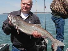 Mark wiedeman of Miles City with a 12 pound lake trout.