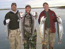 Tyler, Trevor and Mike Haddix of Fort Peck, MT; Fort Rieley, KS and Idaho Falls, ID respectively with a 13,12,10,10 and 5 pound Lake Trout.