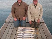 Mike and Curt Channing of Fridley, MN and Eua Claire, WS respectively with 6, 6, 8, 10, 10, and 12 pound Lake Trout.