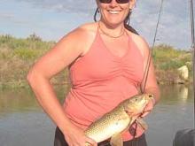 Wendy davis of Miles City with 6 pound carp and proof that carp will take a jig.