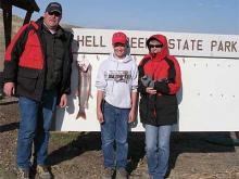 Jim, Payson and Kathy Lippert of Big Timber, MT with Paysons 10 pound lake trout.