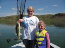 Sophie and Morgan Fairchild of Clyde Park, MT with Sophies 2 pound walleye.