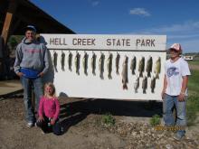 Wyatt, Morgan and Cole Fairchild of Clyde Park, MT with their days catch.