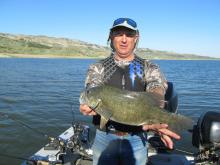 Mike Bricco of Miles City, MT with a 18.5, 4 pound smallmouth bass.