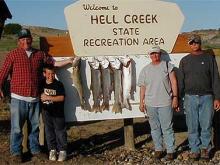 Bruce and Sharron Kellogg and Dan and Austin Bucknell of Ioni, IA with a 8, 9, 10, and 12# lake trout and an 11.5# walleye.