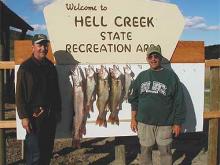 Don Childress of Helena,MT and Bernie with a day's catch of 2, 3.5, 9 and 9.5# walleyes and a 12# northern pike.