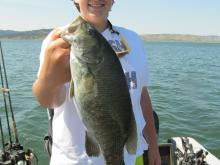 Caden Colombic with a 3 pound smallmouth bass.