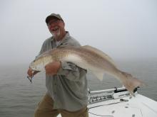 Tom Childress of Albany, GA with a 30# redfish.