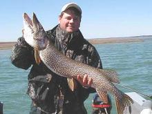 Ross Kellogg, of Ionia, Iowa, with a 40-inch, 17-pound northern pike, his biggest to date.