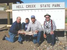 Neil Martin, of Miles City, and Grady, Steve and John Gilpatrick, of Hilger, with Steve's 10-pound northern.