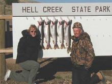 Dave and Cathy Paullin with 7, 7, 7, 8, and 11-pound lake trout.  They also released a 6, 6, 6, 9, 10, and a 13 pounder.