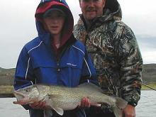 Colter Olmstead with his nine pound, first ever walleyeand his dad Ben.