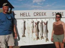 Marcus Grinestaff and Gena Foster of Billings, MT with a 6 pound rainbow and a 2,8,8,and 11 pound lake trout.