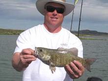 Troy Gilman of Billings, MT with a 2 pound Smallmouth Bass.