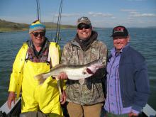 Dale and Mike Chenoweth and John Moxey of Cody, WY with Mikes 10 pound walleye.
