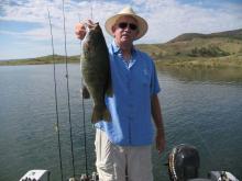 Vic Riggs of Miles City, MT with a 4 pound smallmouth bass.