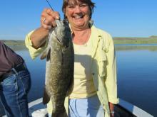 Sue Pistorius of Billings, MT with a 3 pound smallmouth bass.