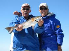 My self and Bob Quick with a red drum (redfish)