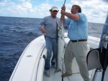 A. Dood and Mark Houghtalling with a large barracuda.