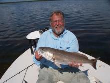 A. Dood with a nice red drum (redfish).