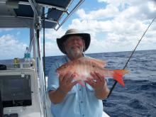 A. Dood with a mutton snapper.