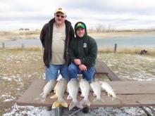 Ernest Butts and Matt Phillips with their limit of lake trout.