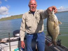 Rob Johnson of Melville, MT with a 18.5, 4 pound smallmouth bass.