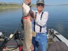 Larry Hancock of Butte, MT with a 36,  14 pound northern pike.