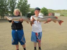 Sophie Fairchil and Tyler Gillespie with their northern pike. 
