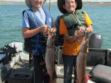 Kole And Buddy Boucher with their firsh northern pike.