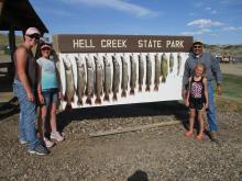 Penny Redli, Bailey and Adison Eaton and Jim Redli with their days catch.
