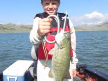 Ethan Justice with a smallmouth bass.